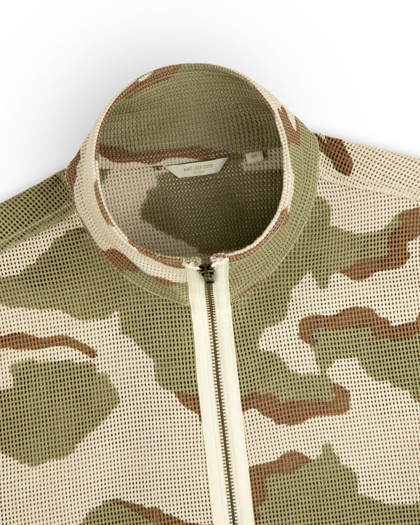 Camo Mesh Zip Overshirt in camo print mesh with a mock neck, front zipper, and internal brand label.