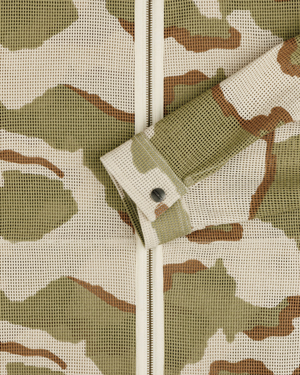 Camo Mesh Zip Overshirt in a tan, olive, and brown camouflage mesh fabric with a buttoned sleeve cuff.