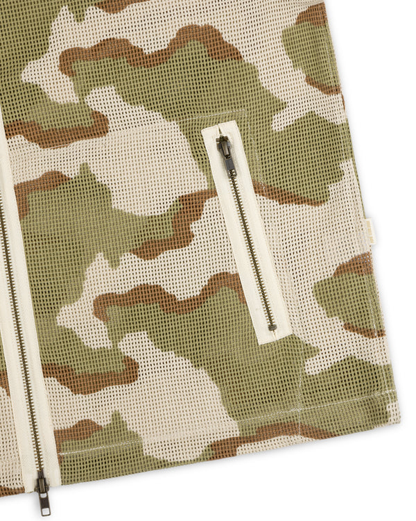 Close-up of a Camo Mesh Zip Overshirt in green, brown, and beige, featuring a zippered pocket and front zipper.