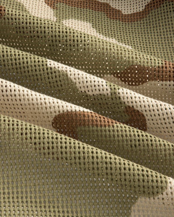 Folded green, tan, and brown camouflage mesh fabric of the Camo Mesh Zip Overshirt.