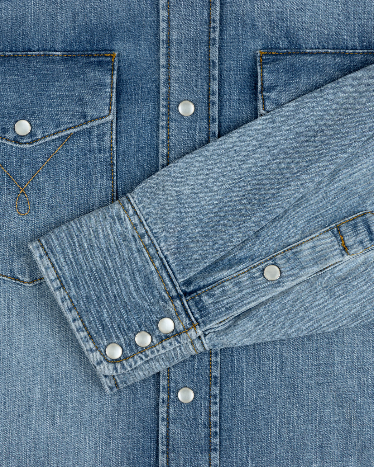 Denim Western Shirt in blue denim with snap buttons and a chest pocket.