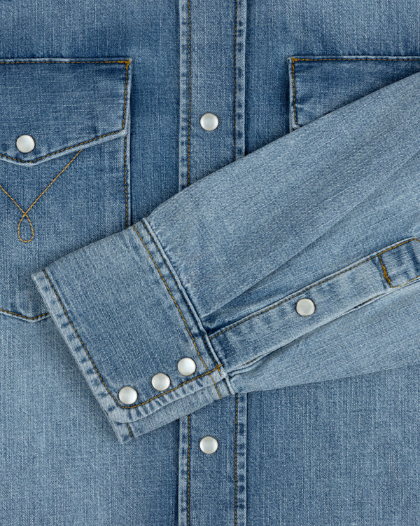 Denim Western Shirt in blue denim with snap buttons and a chest pocket.
