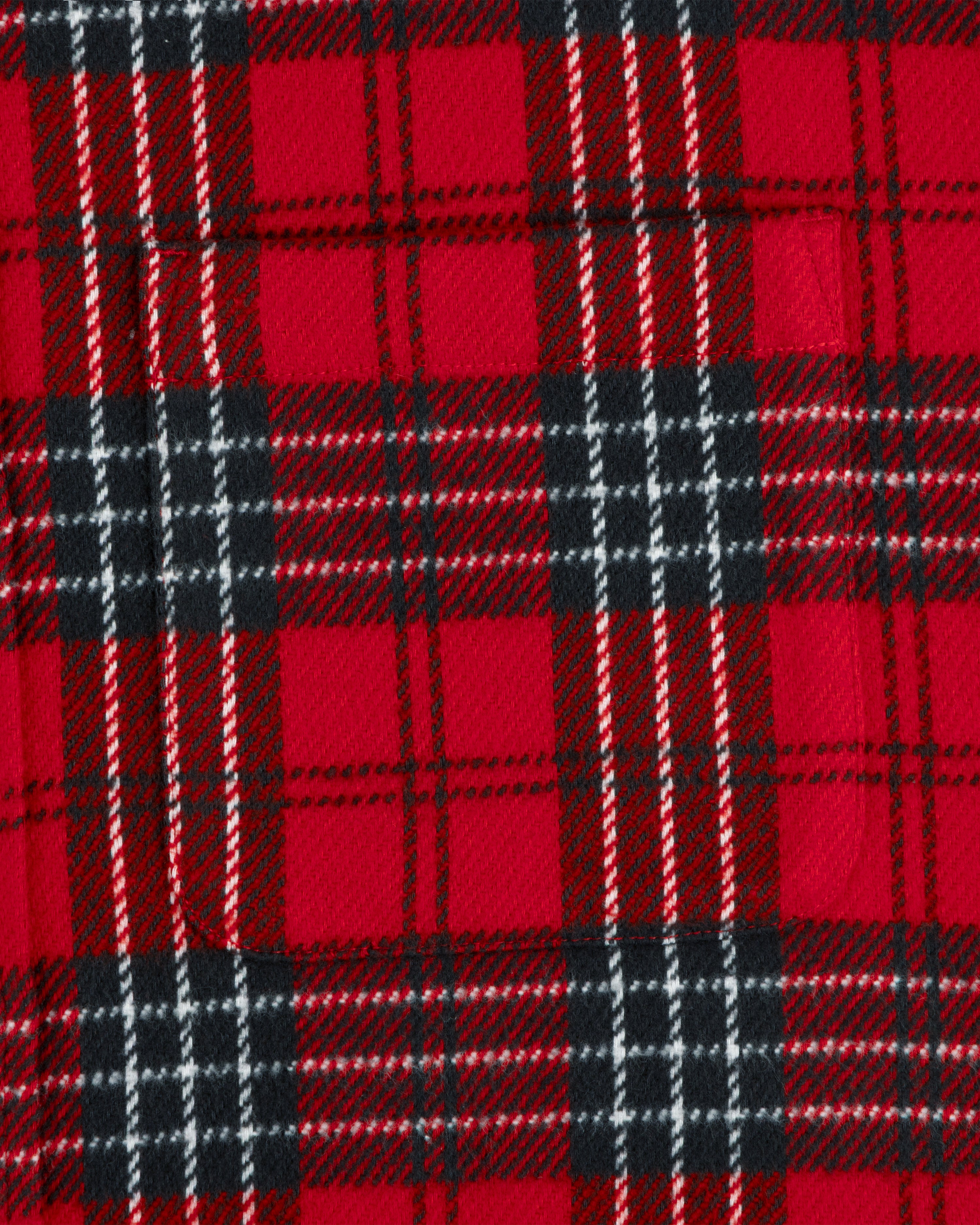 Close-up of a red, black, and white Yarn Dyed Plaid Overshirt featuring a chest pocket.
