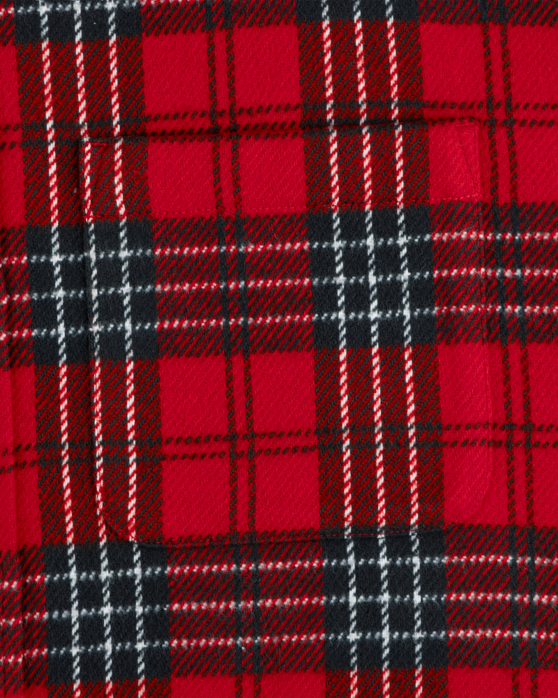 Close-up of a red, black, and white Yarn Dyed Plaid Overshirt featuring a chest pocket.