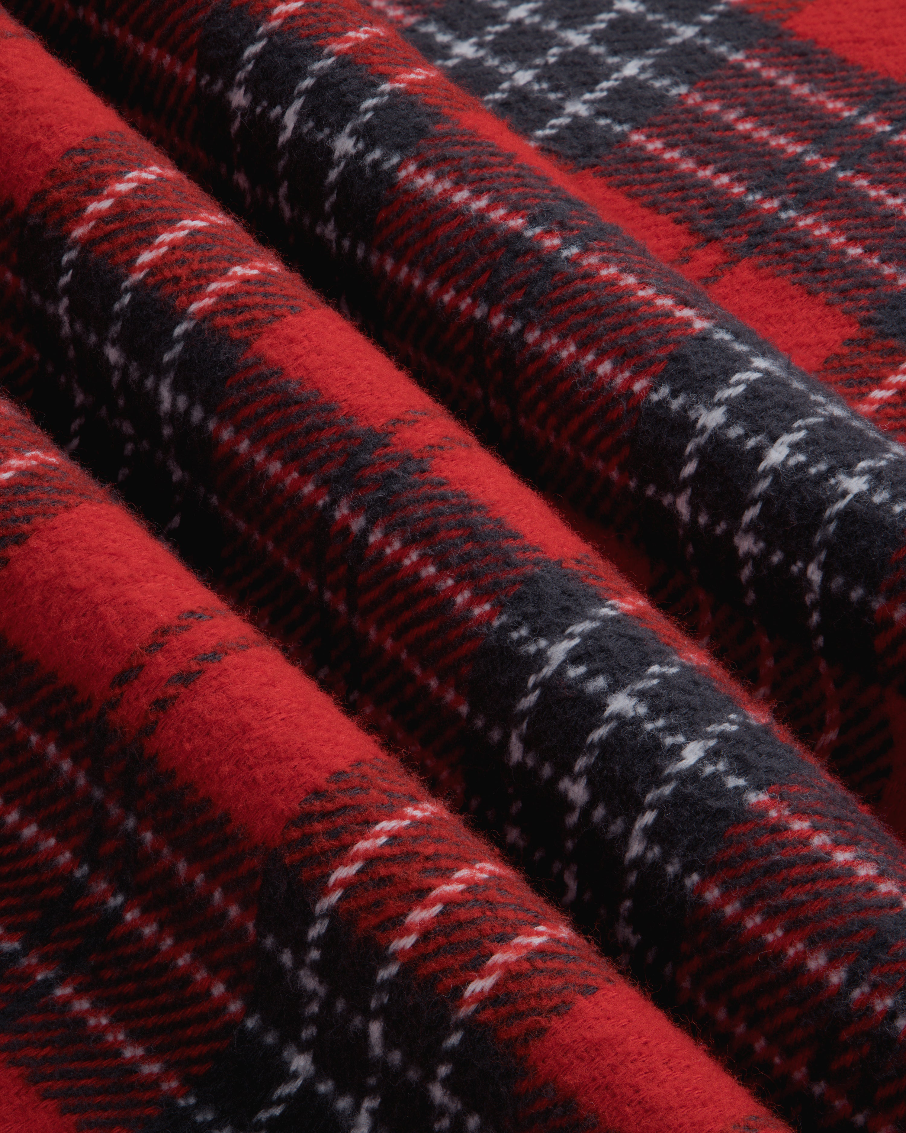 Folded red, black, and white Yarn Dyed Plaid Overshirt fabric.