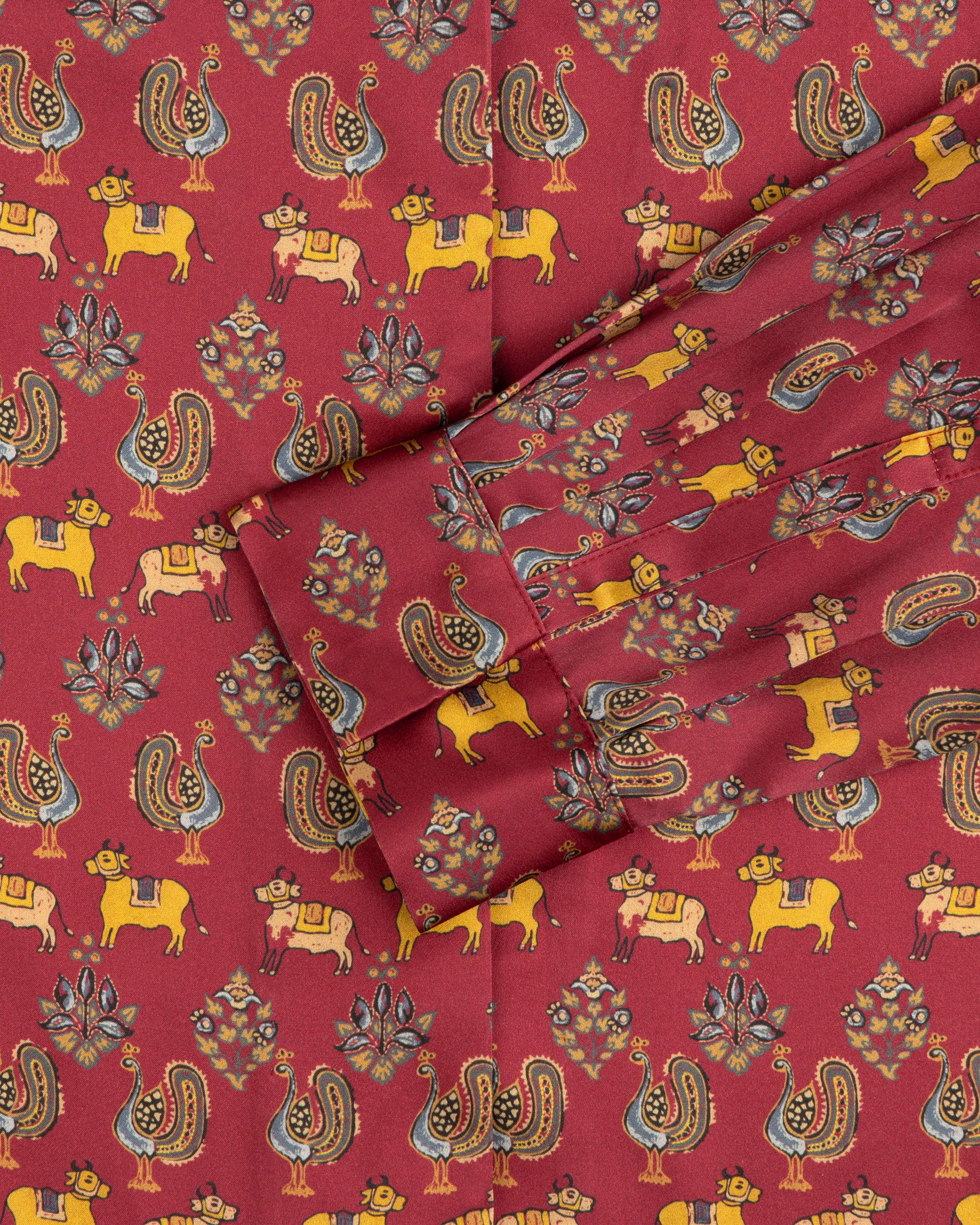 Archival Print Silk Tie Neck Blouse in red with yellow cows, stylized birds, and floral motifs.