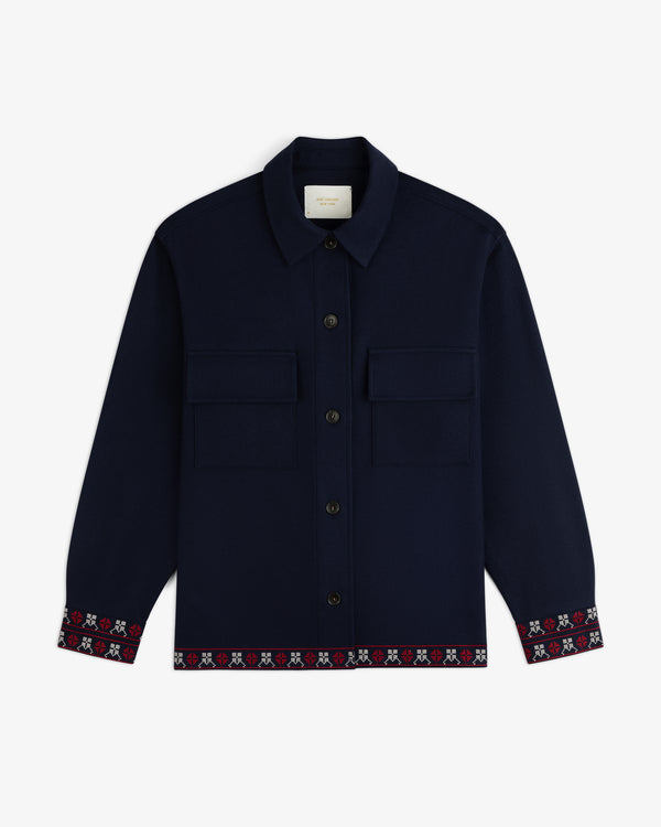 Mani Embroidered Wool Jacket in navy, featuring two chest pockets and decorative embroidery at the cuffs and hem.