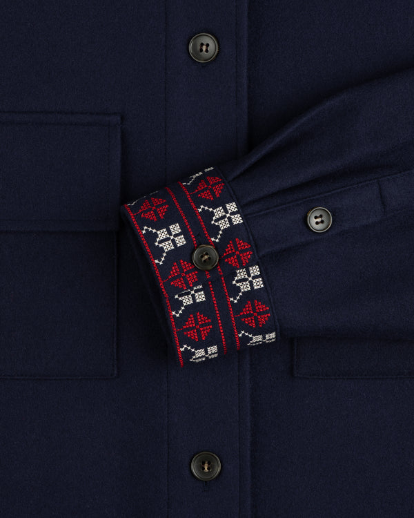 Mani Embroidered Wool Jacket in navy with red and white cross-stitch embroidery on the cuff.