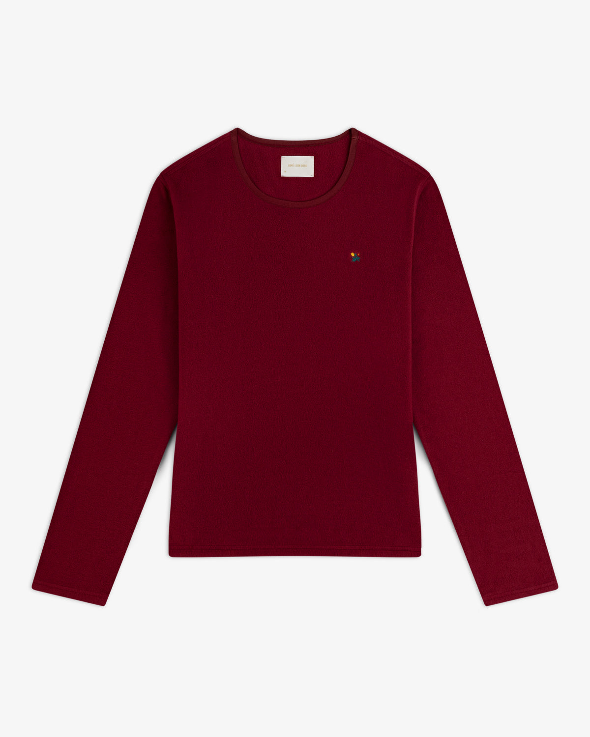Deep red Crest Long-Sleeve Fleece Tee with a small multicolored floral embroidery on the chest.