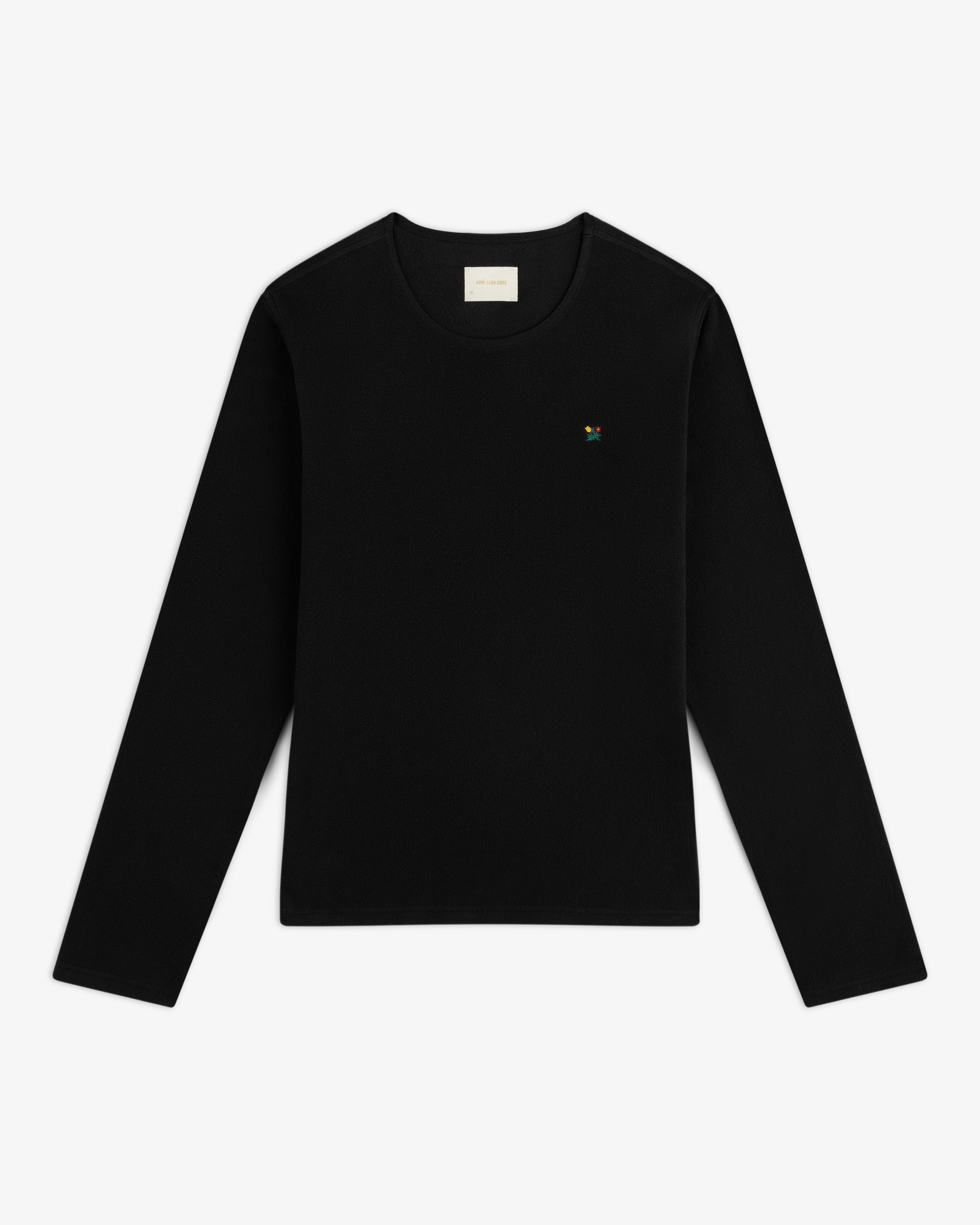 Black Crest Long-Sleeve Fleece Tee with a small flower embroidery on the left chest.