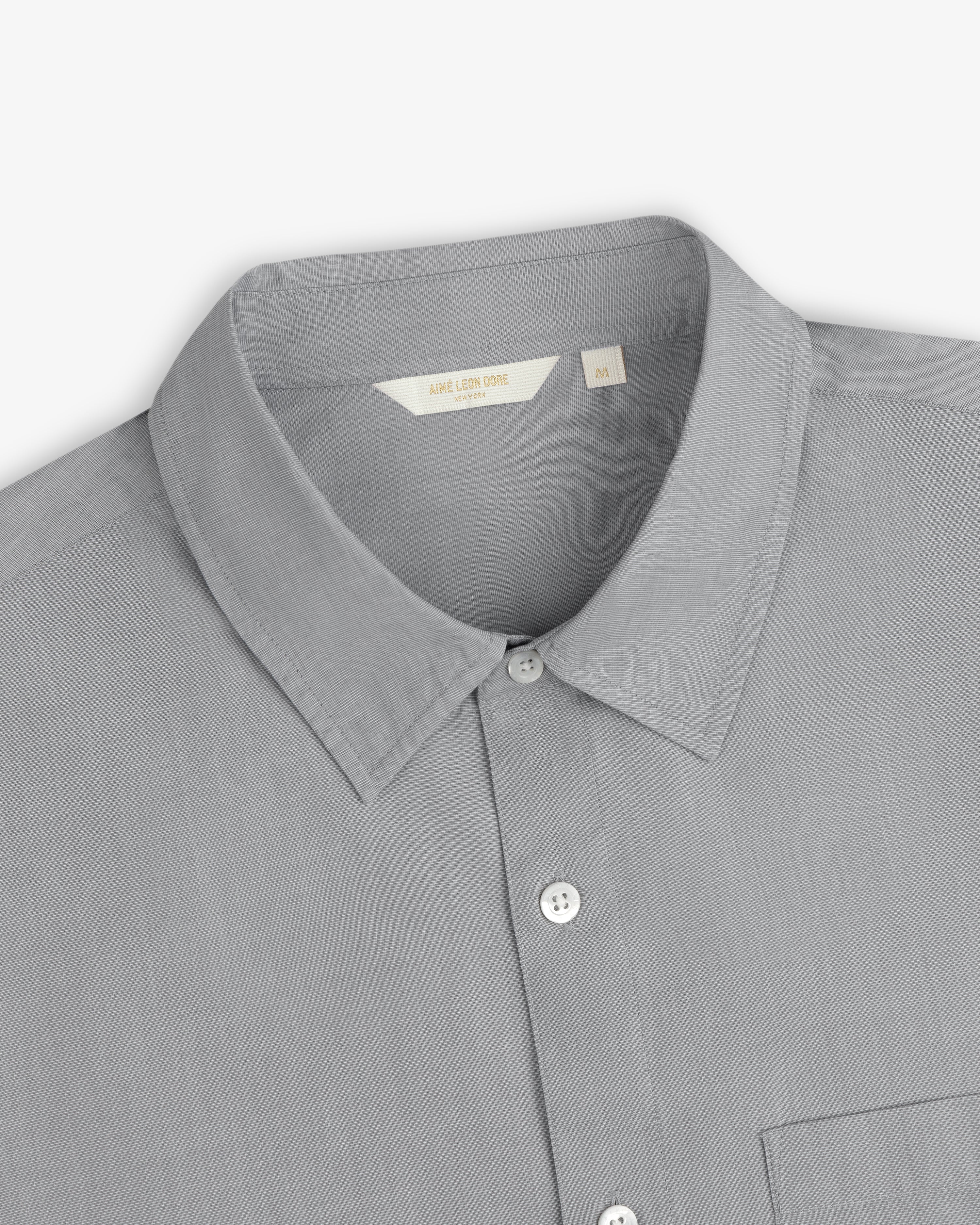 Poplin Casual Shirt in light gray with collar and pocket, shown flat on a white background.