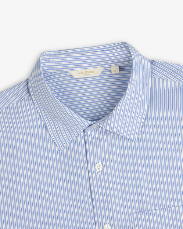 Poplin Casual Shirt in blue and white stripes, collared with pocket, shown from chest up.