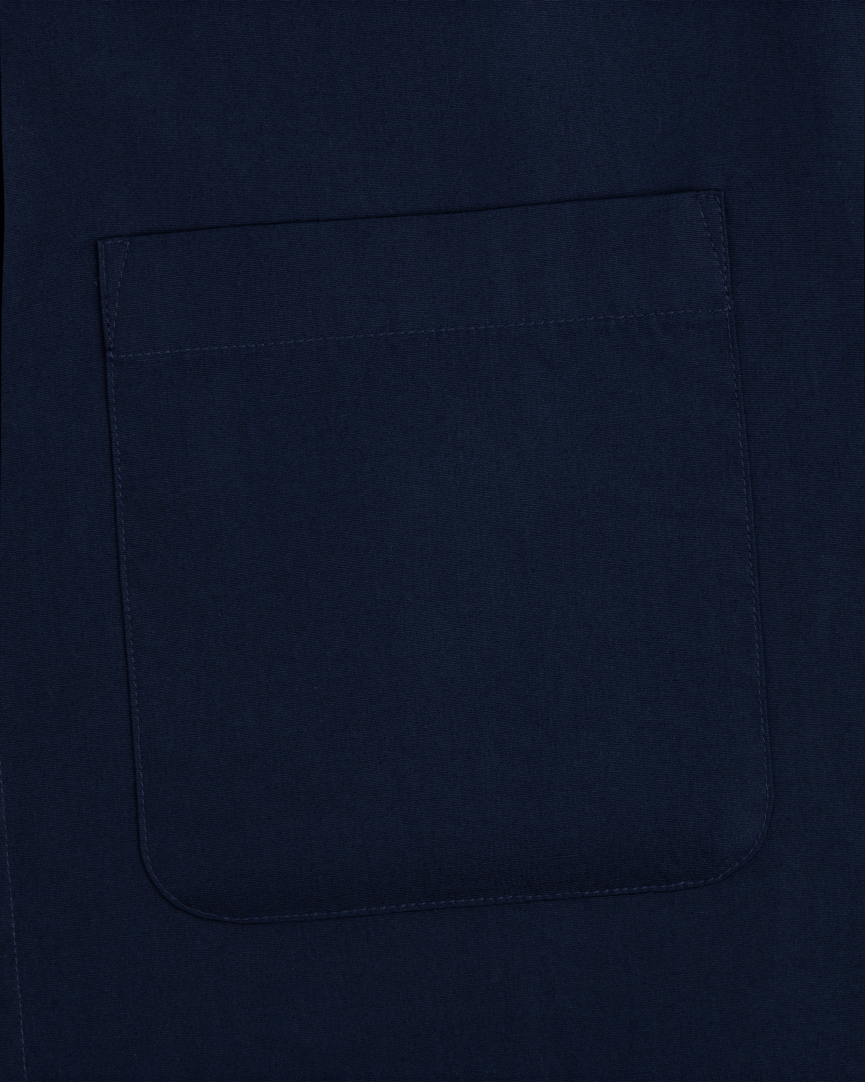 Close-up of a navy Poplin Casual Shirt fabric featuring a stitched square pocket.