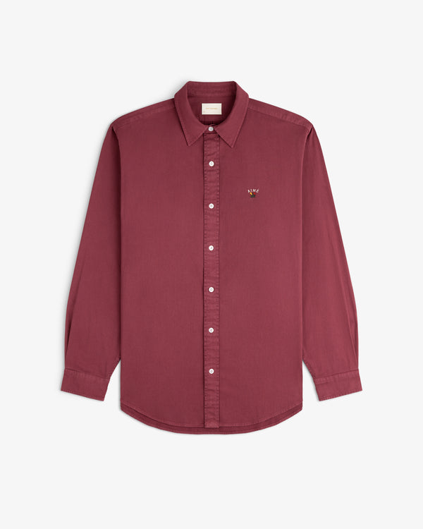 Garment Dyed Leon Overshirt: maroon long-sleeve button-up with collar and small left chest embroidered logo.
