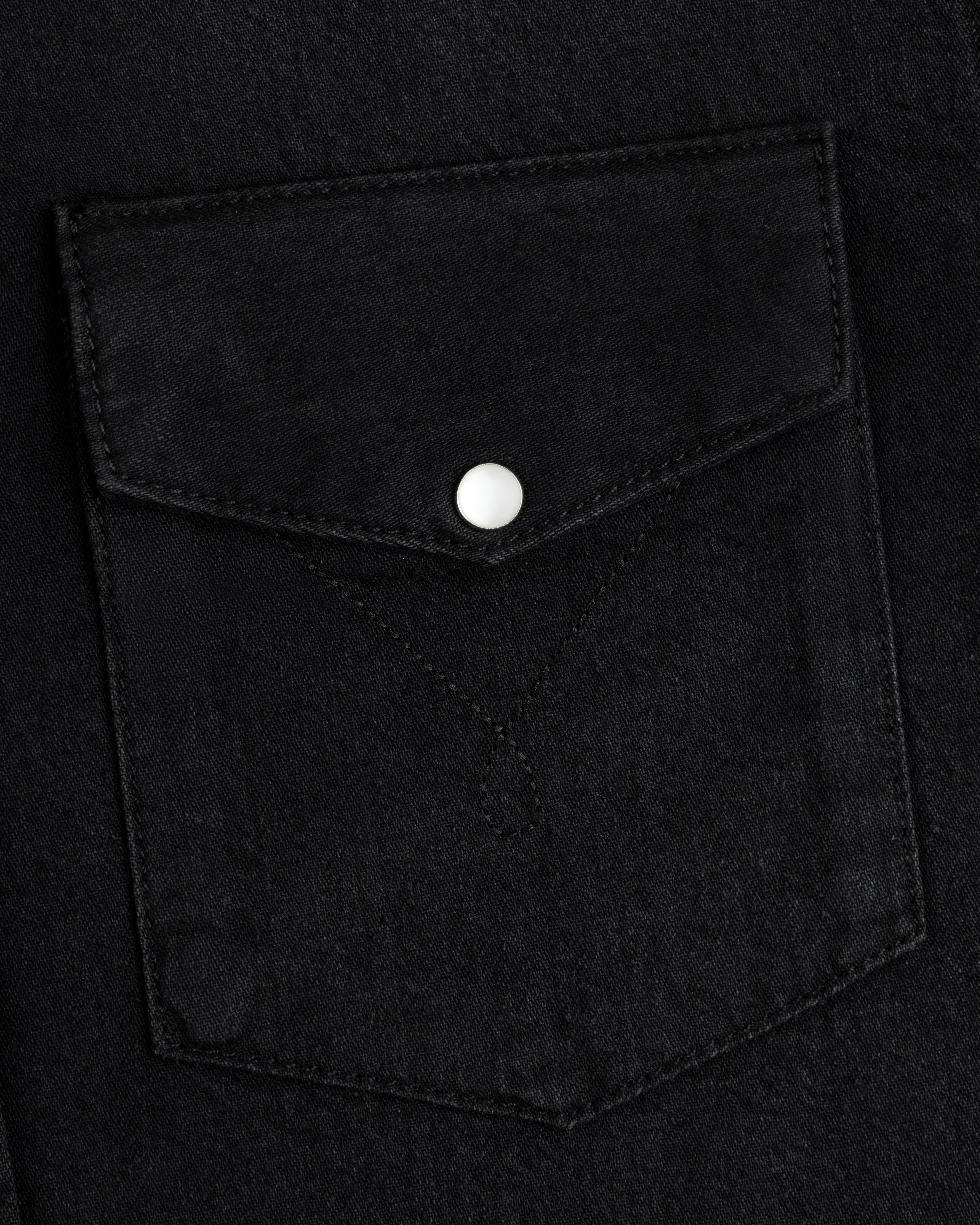 Black Denim Western Shirt pocket with a pointed flap and a single silver snap button.
