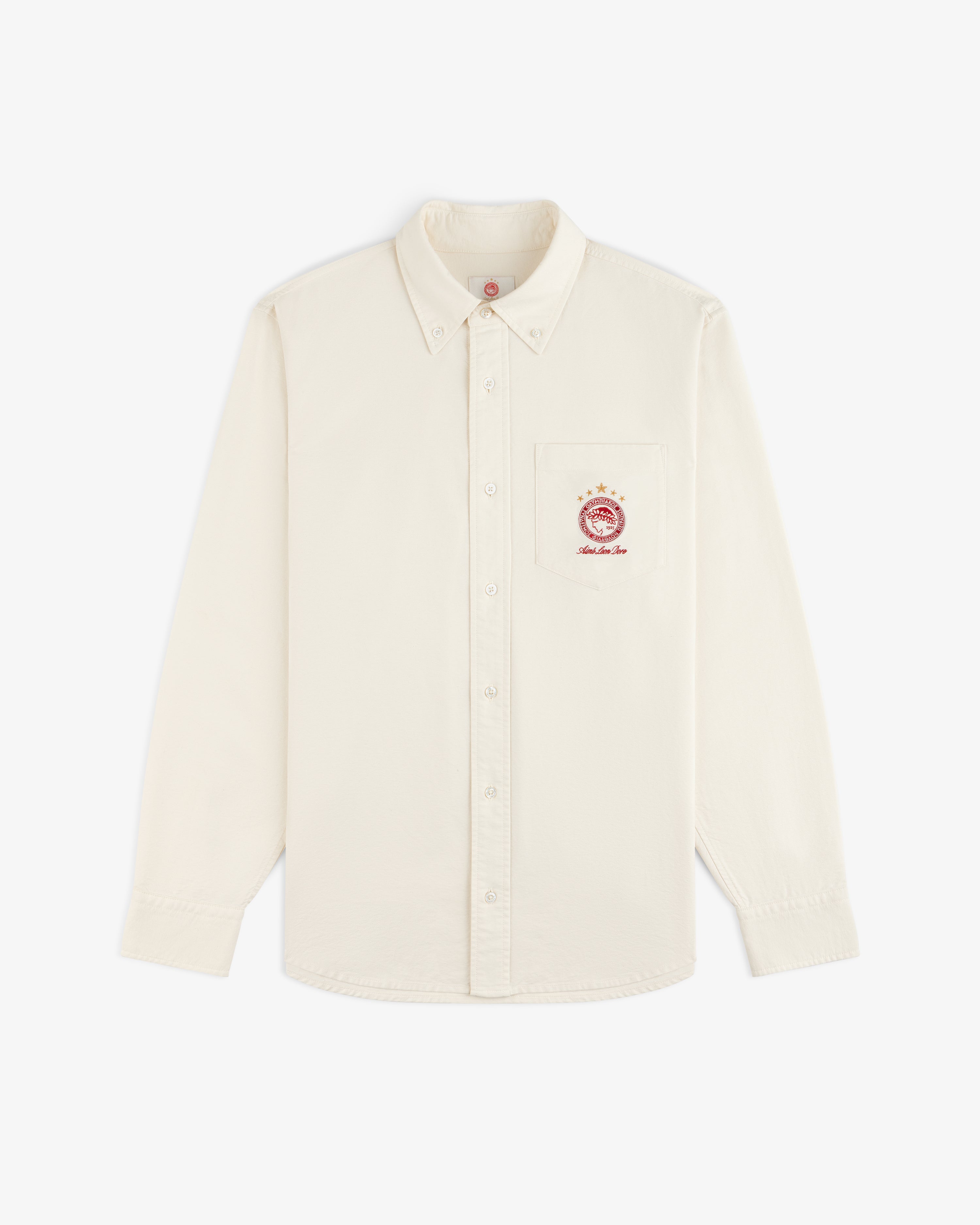 Cream-colored long-sleeve ALD / Olympiacos F.C. Logo Oxford Shirt with an embroidered sports crest on the chest pocket.