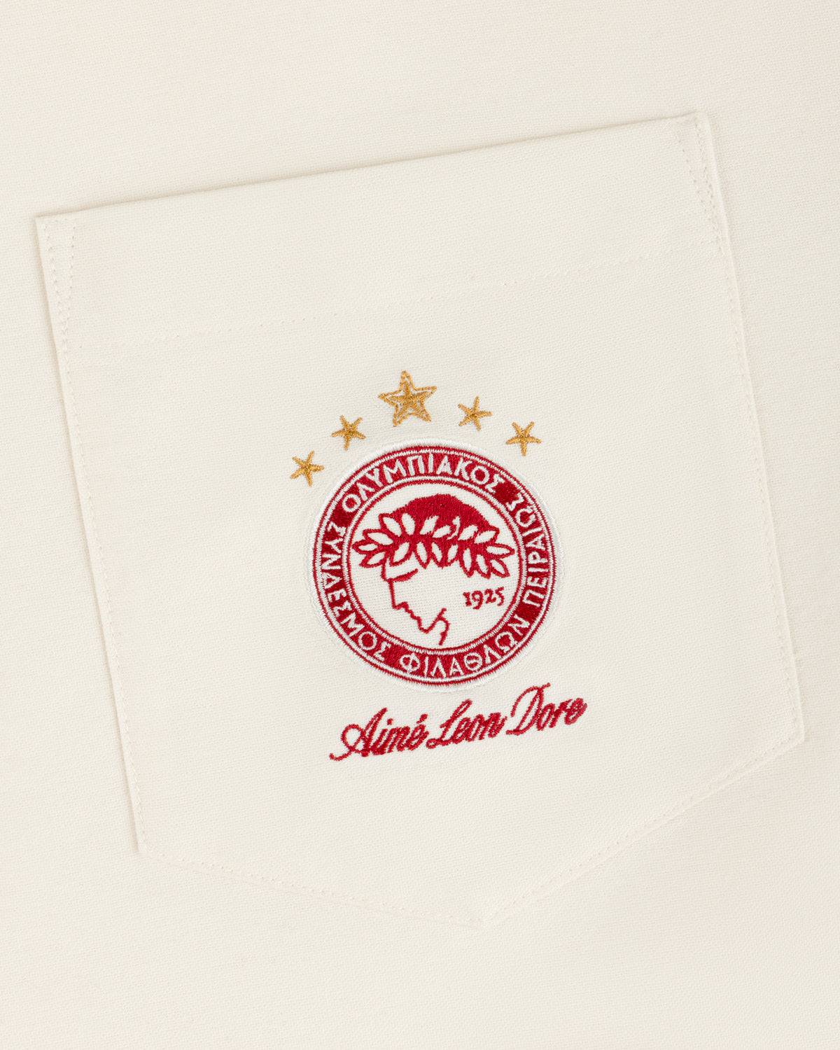 ALD / Olympiacos F.C. Logo Oxford Shirt featuring a chest pocket with an embroidered team logo and Aimé Leon Dore text.
