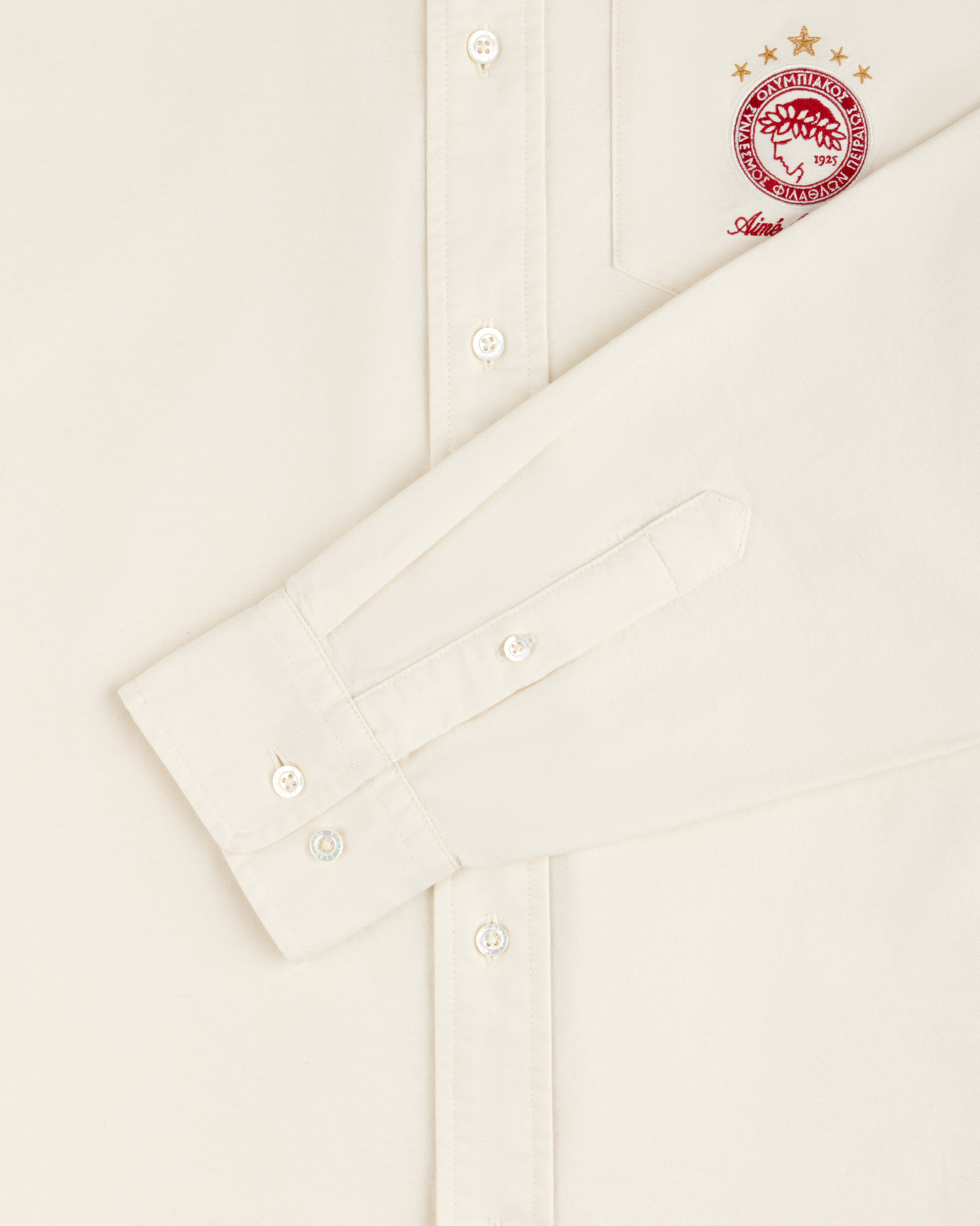 Off-white ALD / Olympiacos F.C. Logo Oxford Shirt with a red team logo embroidered on the chest pocket.