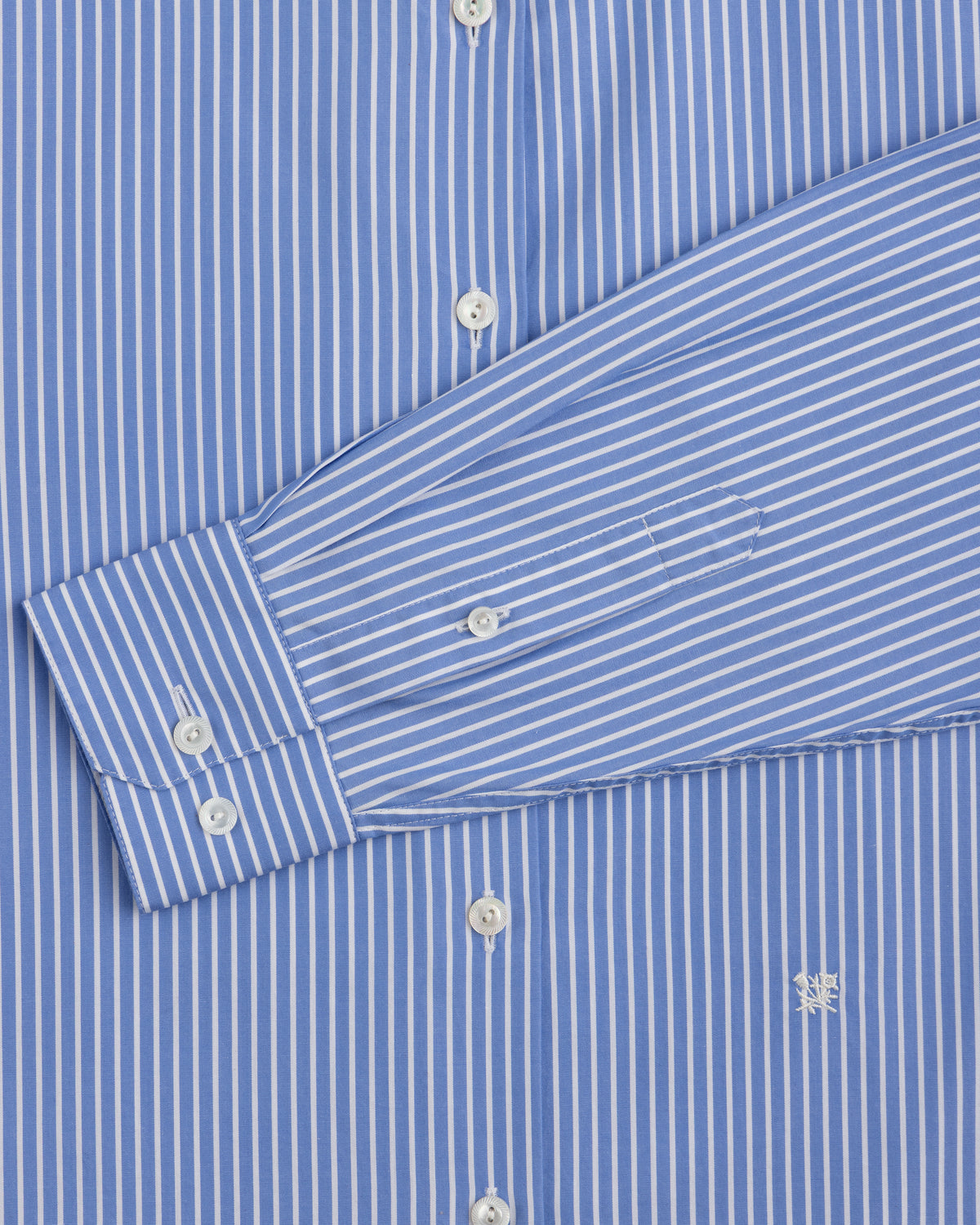 Striped Button Down Poplin Shirt in blue and white vertical stripes with a long-sleeved button-down collar and chest logo.