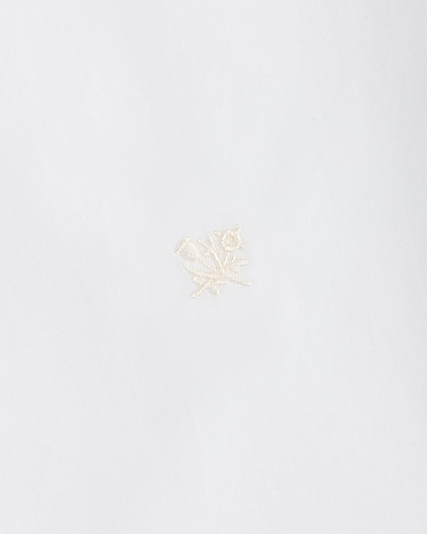 Button Down Poplin Shirt in white fabric featuring a small, tonal embroidered floral design.