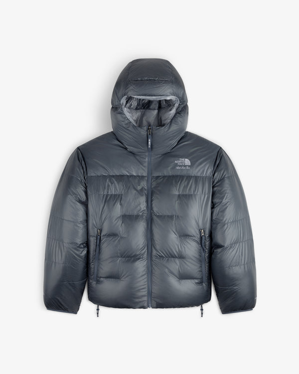 ALD / The North Face Reversible Pertex® Nuptse Jacket with hood, front zip, and side pockets on white background.