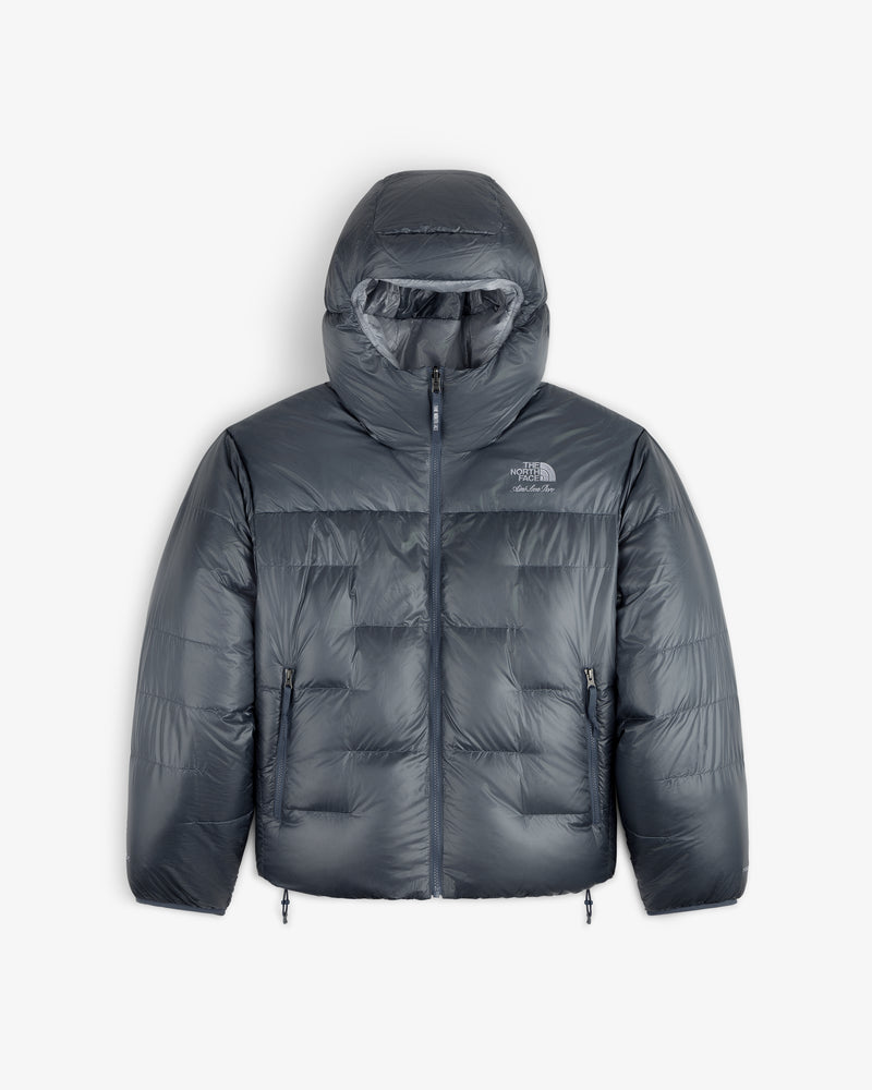 ALD / The North Face Reversible Pertex® Nuptse Jacket with hood, front zip, and side pockets on white background.
