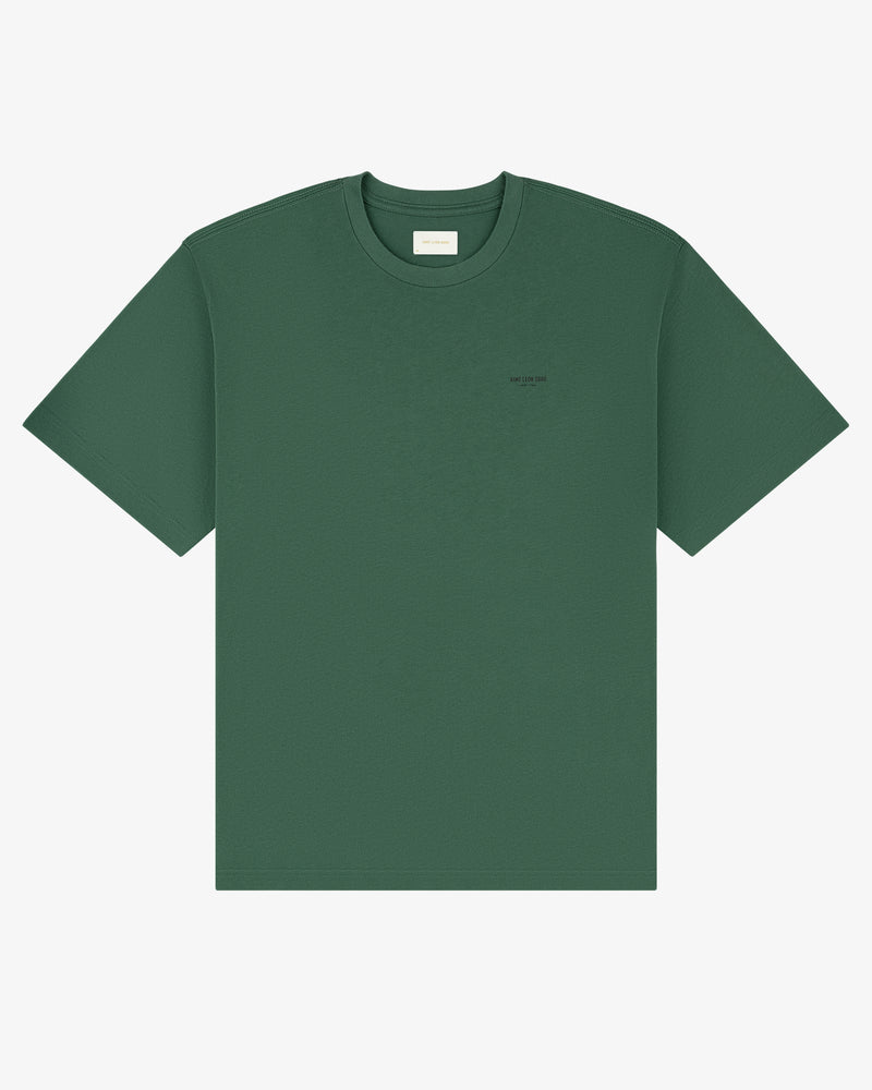 Micro Logo Tee in green with a small chest logo, shown on a plain white background.