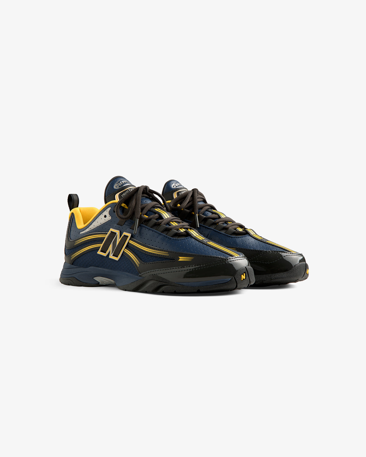ALD / New Balance RC56 navy and yellow sneakers with black soles and large N logos, displayed on a white background.