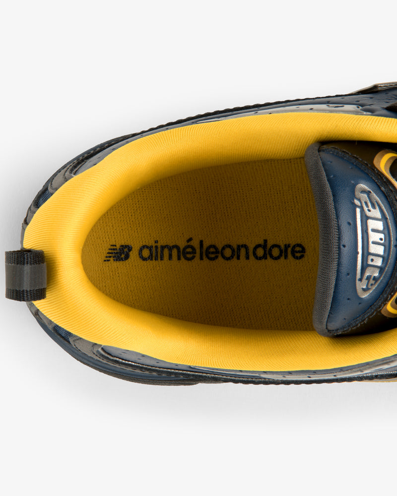Top view of the ALD / New Balance RC56 sneaker with yellow inner lining and insole branding.