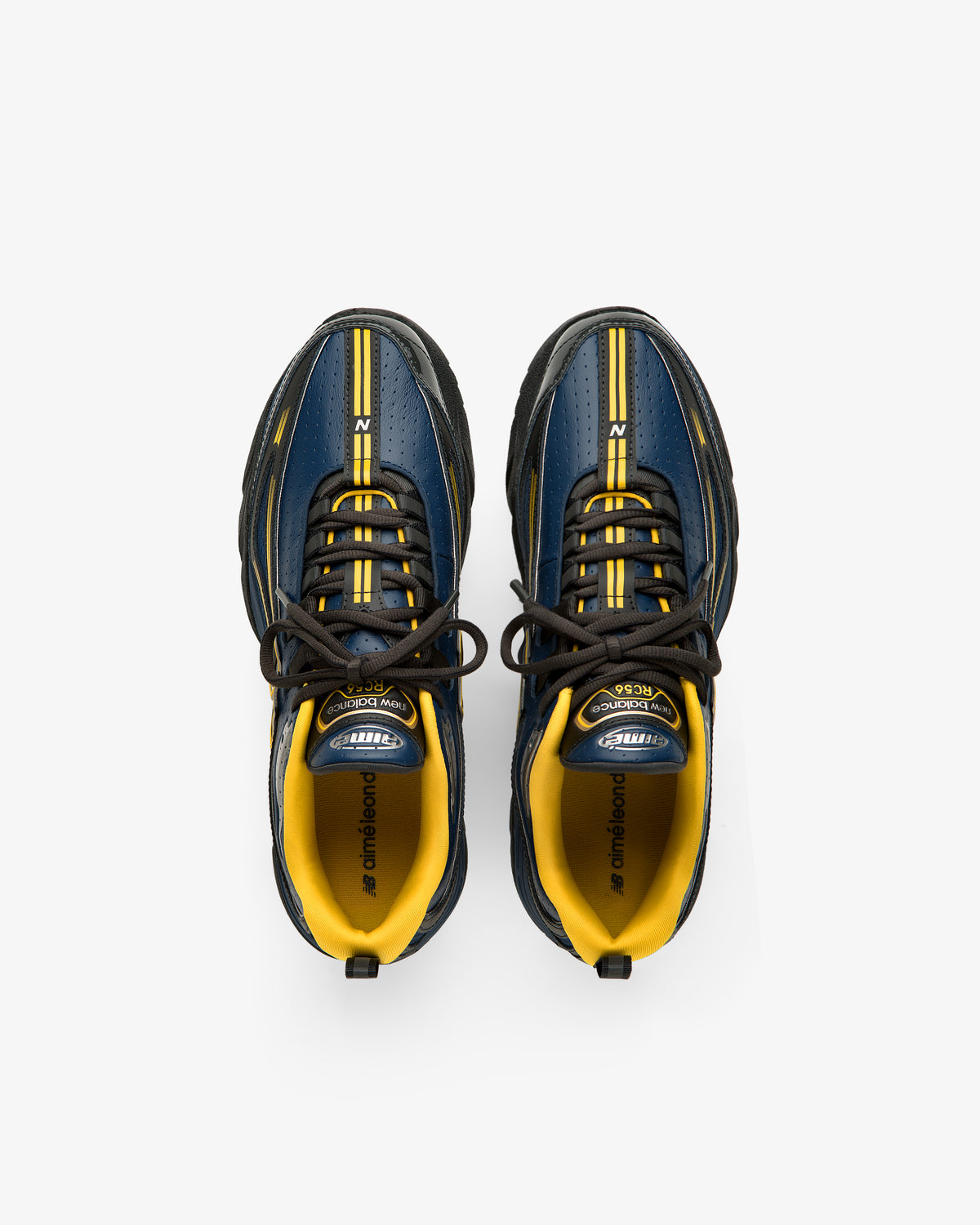 ALD / New Balance RC56 sneakers in blue and yellow with black laces, viewed from above on a white background.