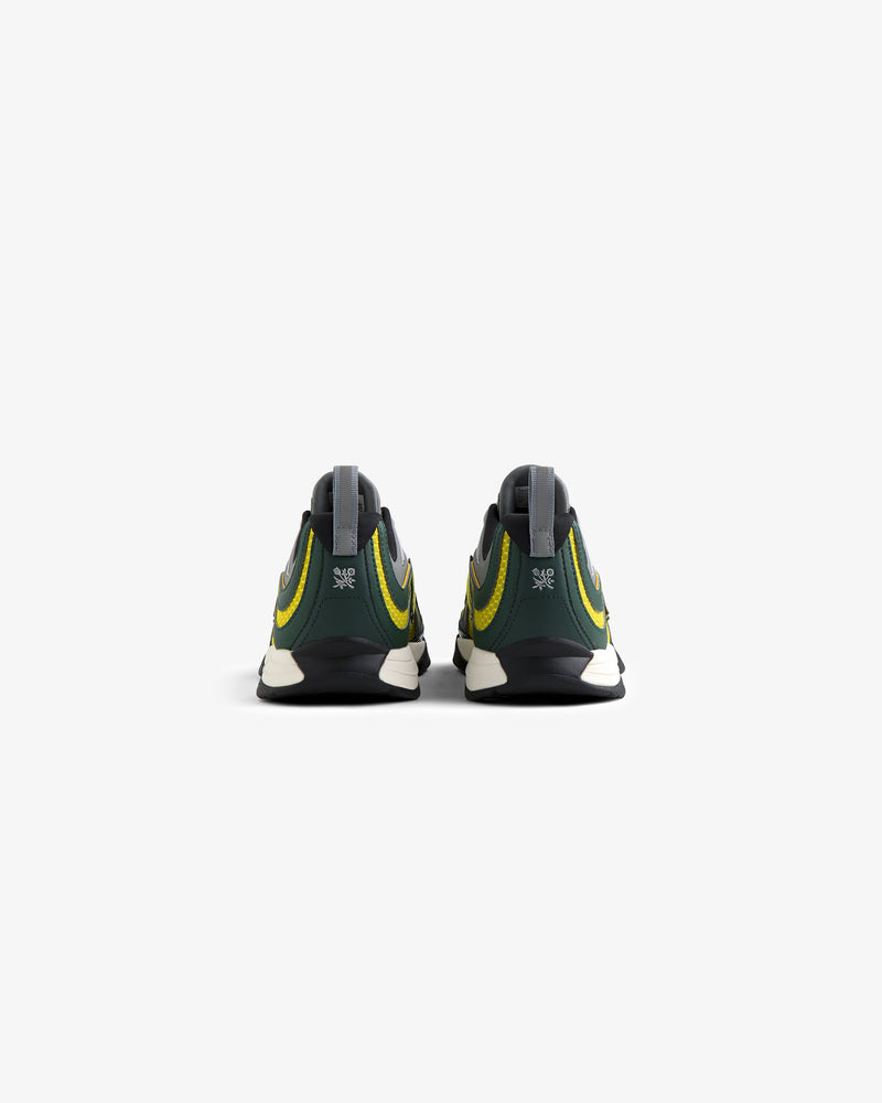 ALD / New Balance RC56 sneakers in green and yellow shown from the back on a plain white background.