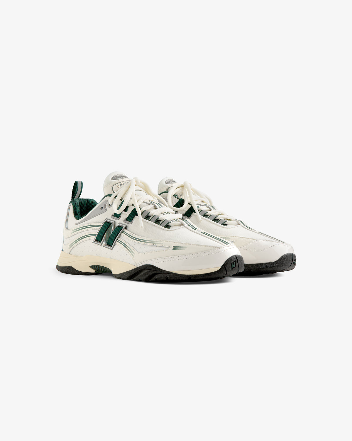 The ALD / New Balance RC56 sneakers in white and green with black soles, displayed on a plain white background.
