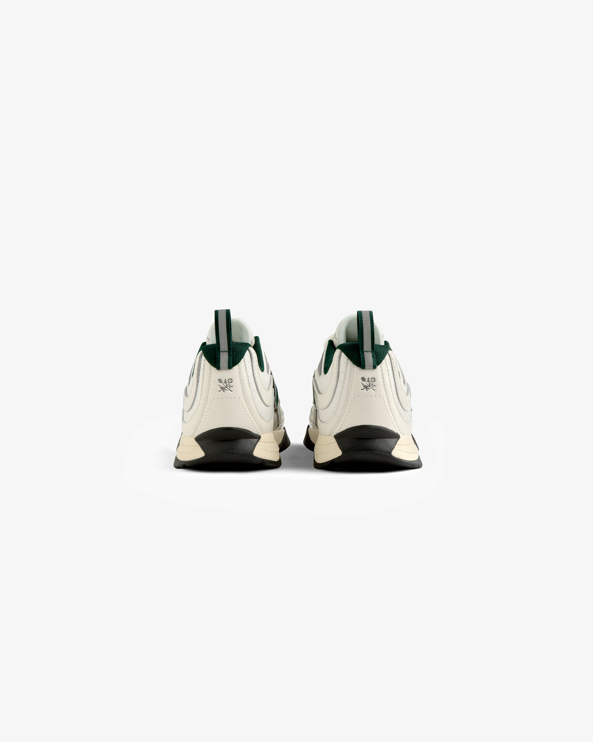 The ALD / New Balance RC56 sneakers in white with green accents, displayed from the back on a plain white background.