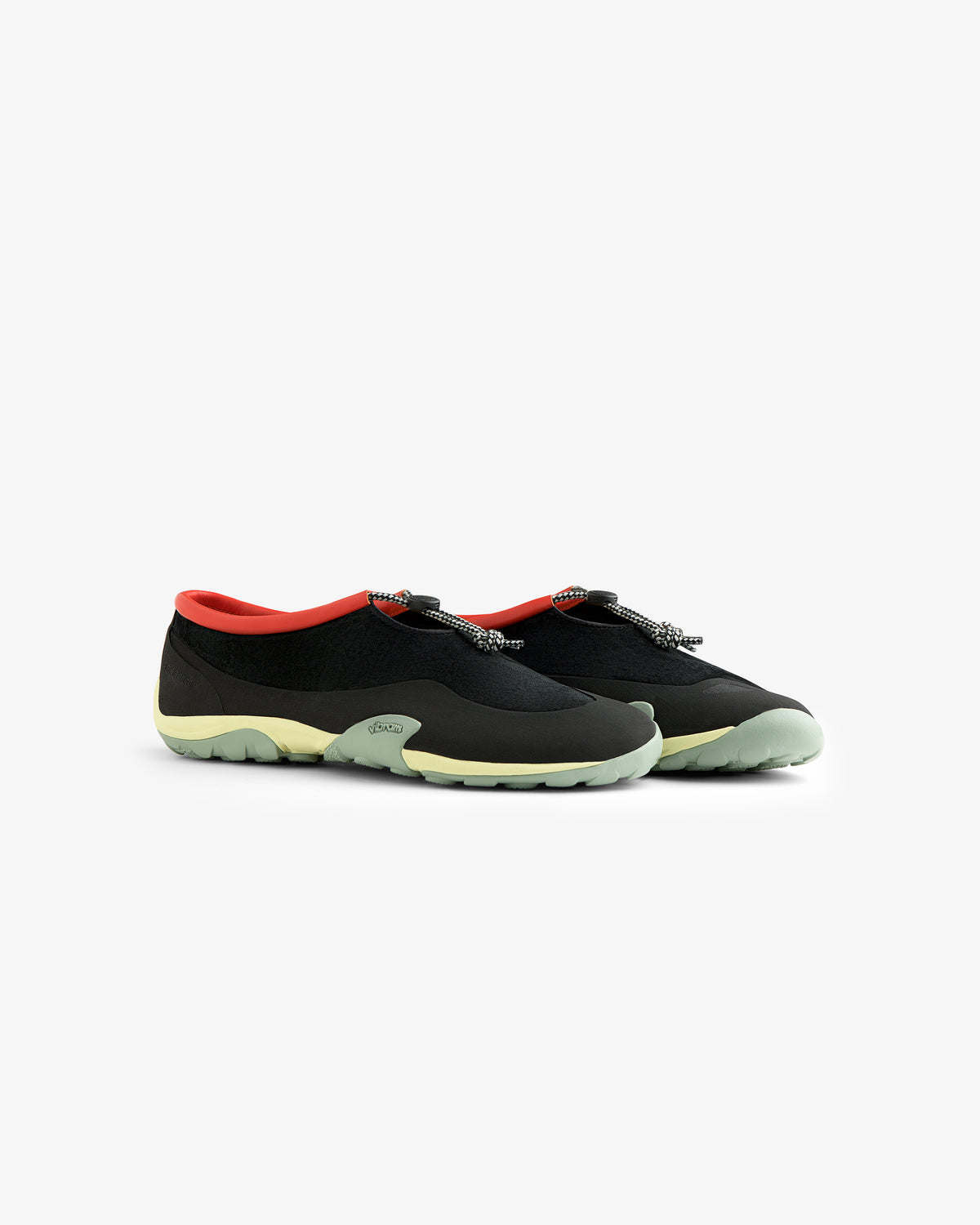 The ALD / New Balance MT10T Sport Shoe in black features light green soles and a red inner lining, on white background.