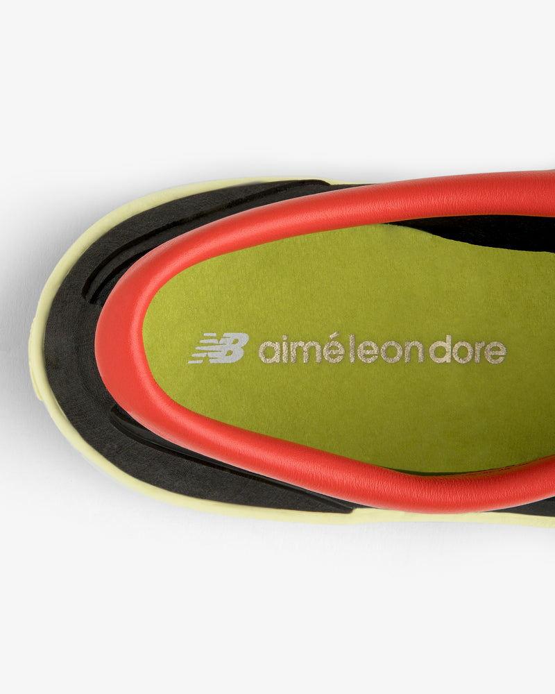 Top view of ALD / New Balance MT10T Sport Shoe insole in lime green with white Aimé Leon Dore branding.