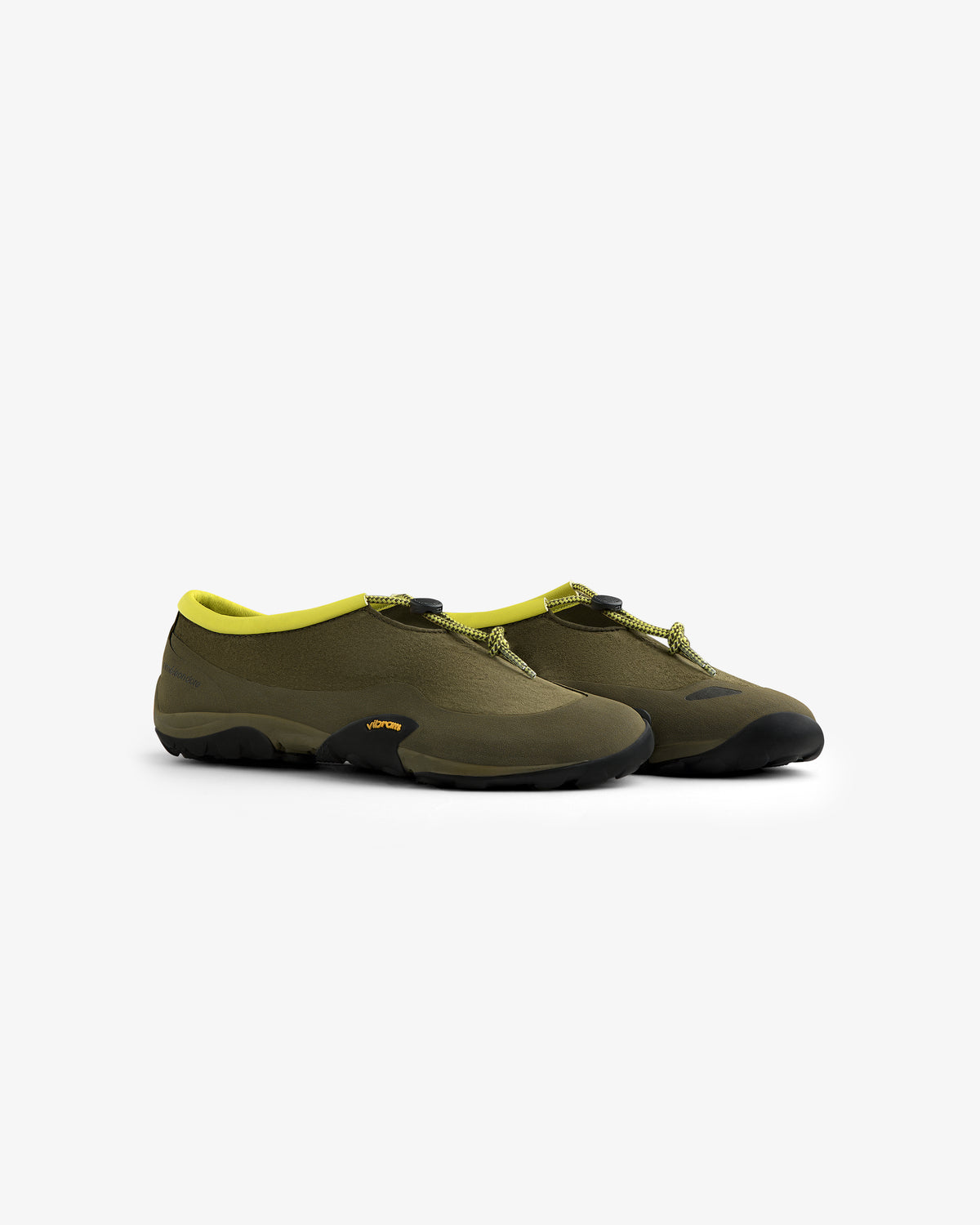 The ALD / New Balance MT10T Sport Shoe in olive green features black soles and yellow trim on a white background.