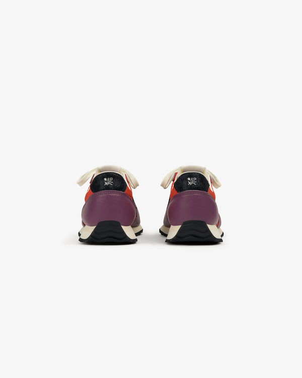 ALD / New Balance 471 sneakers shown from the back in purple, red, and cream with black soles on a white background.