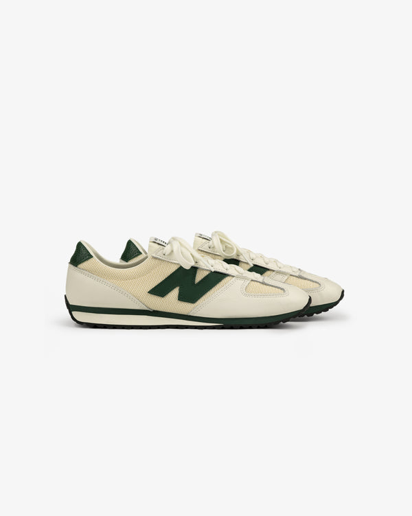 The ALD / New Balance 471 sneakers in beige and green, with a large N logo, shown side view on white background.