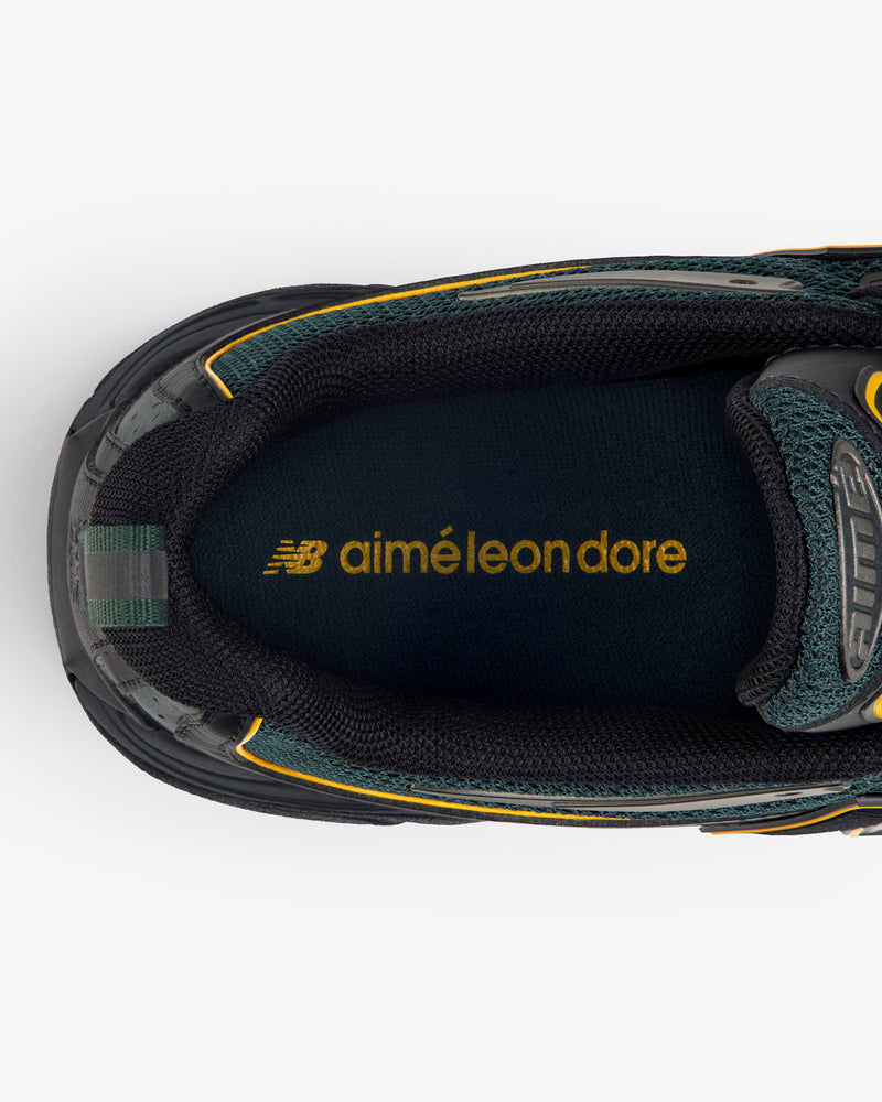 Close-up of ALD / New Balance RC56 sneaker insole featuring yellow aimé leon dore branding.