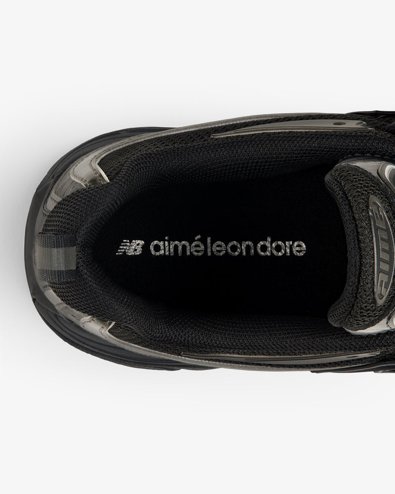 Top view of ALD / New Balance RC56 black sneaker with white aimé leon dore and NB logo on the insole.