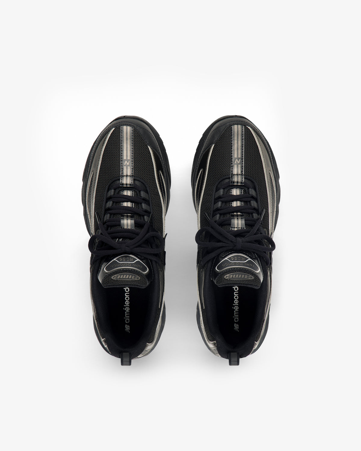 Overhead view of a pair of black ALD / New Balance RC56 sneakers with silver accents.