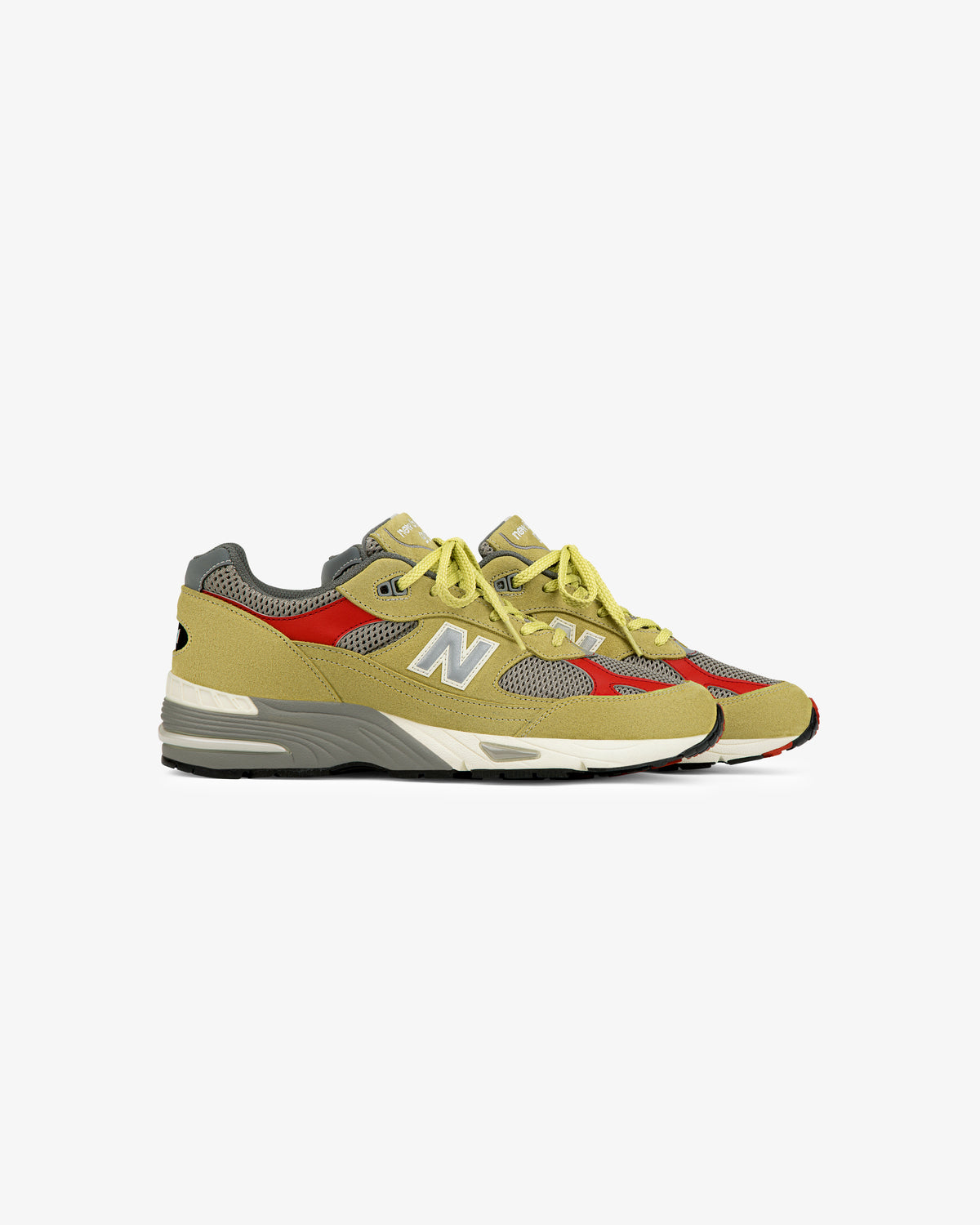ALD / New Balance Made in UK 991 sneakers in yellow, gray, and red with mesh panels and N logos, on white background.