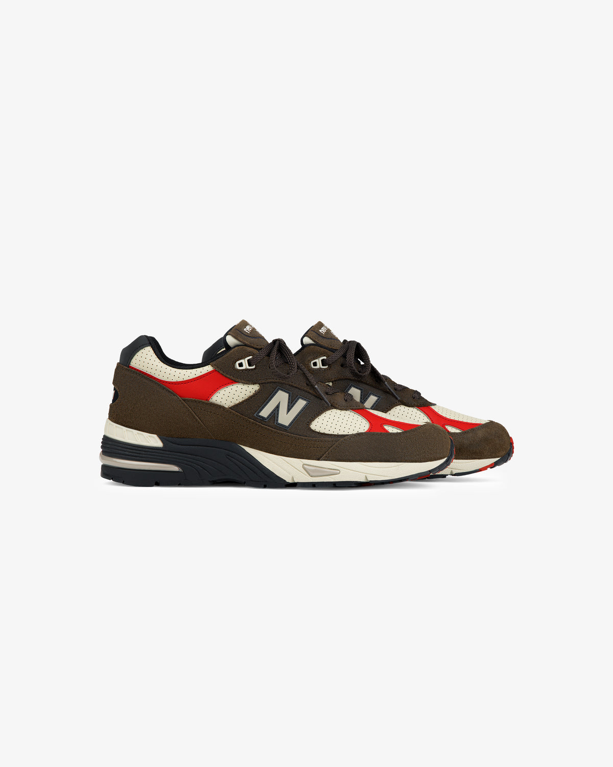 The ALD / New Balance Made in UK 991 sneakers in brown, red, cream, and black with mesh and suede panels.