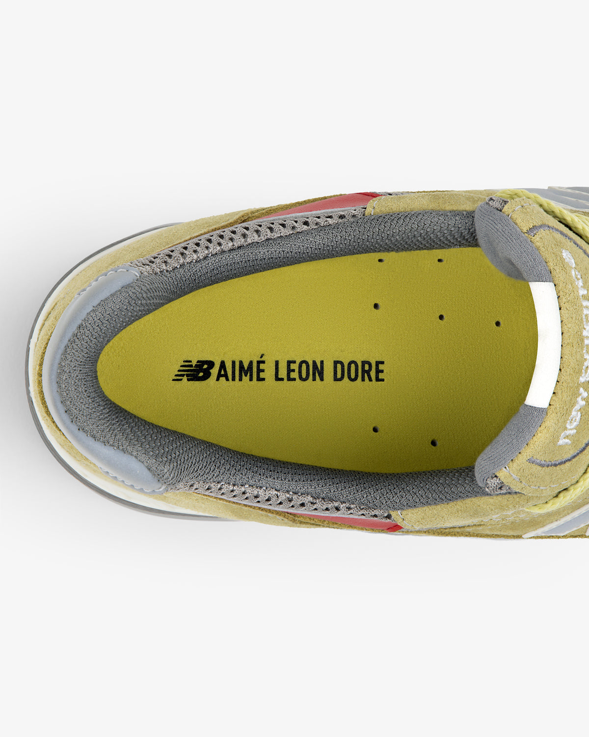 Top view of ALD / New Balance Made in UK 991 with yellow suede, gray lining, and AIMÉ LEON DORE on the insole.