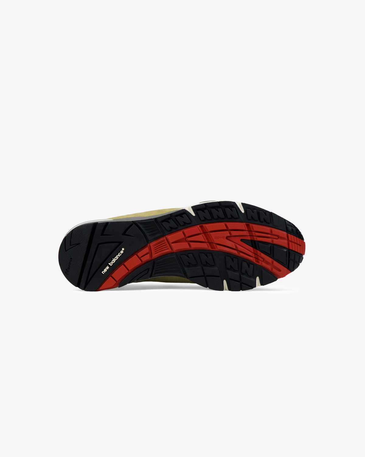 The ALD / New Balance Made in UK 991 sneaker has a black and red rubber sole with patterned tread and New Balance text.