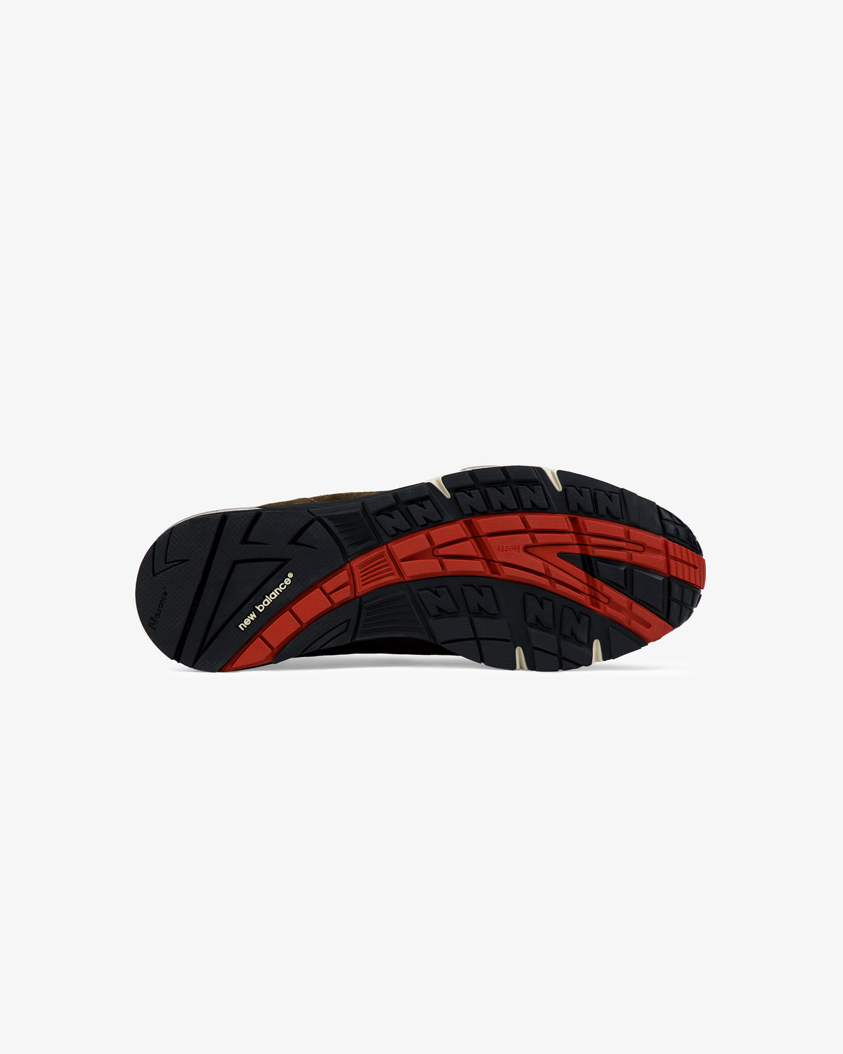 Black sole with red and beige accents, patterned tread, and visible ALD / New Balance Made in UK 991 branding.