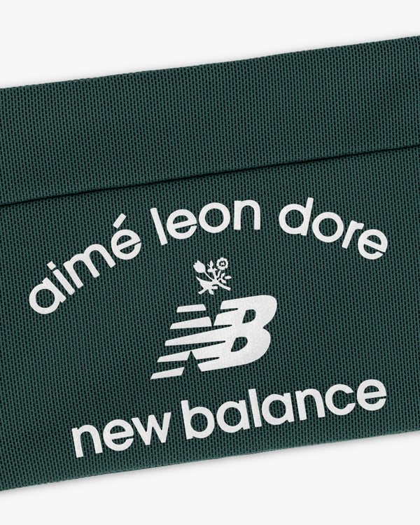 Dark green ALD / New Balance Performance Running Belt with white text and stylized NB leaf logo.