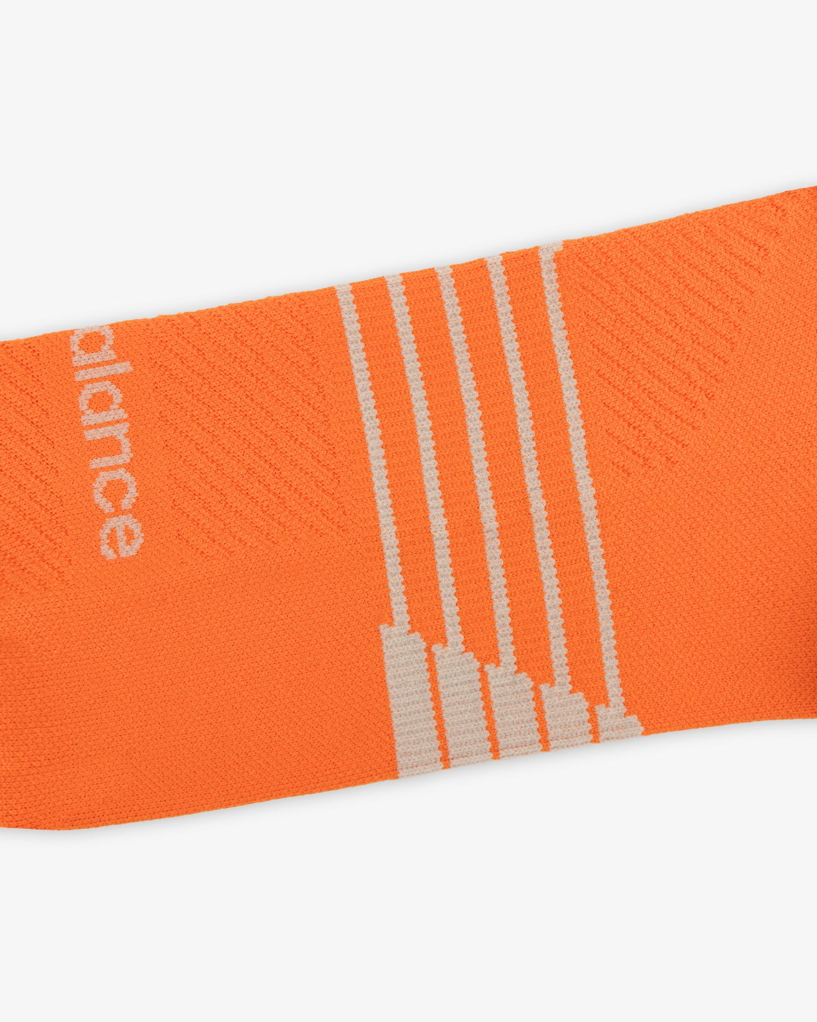 ALD / New Balance Running Crew Sock: orange with white diagonal stripes and partial white text on left side.