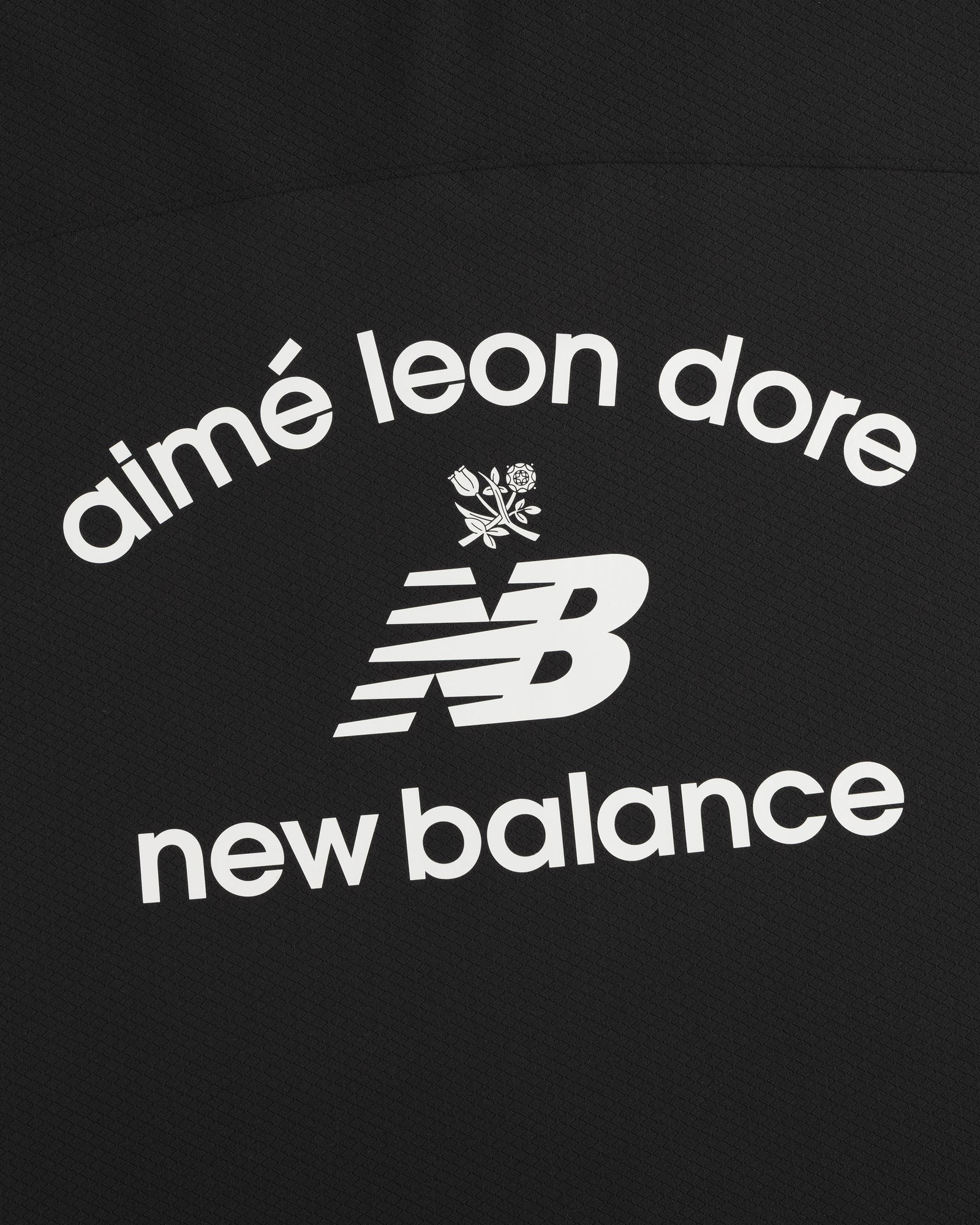 ALD / New Balance Full-Zip Warmup Hoodie: White text and NB logo with floral graphic on black background.