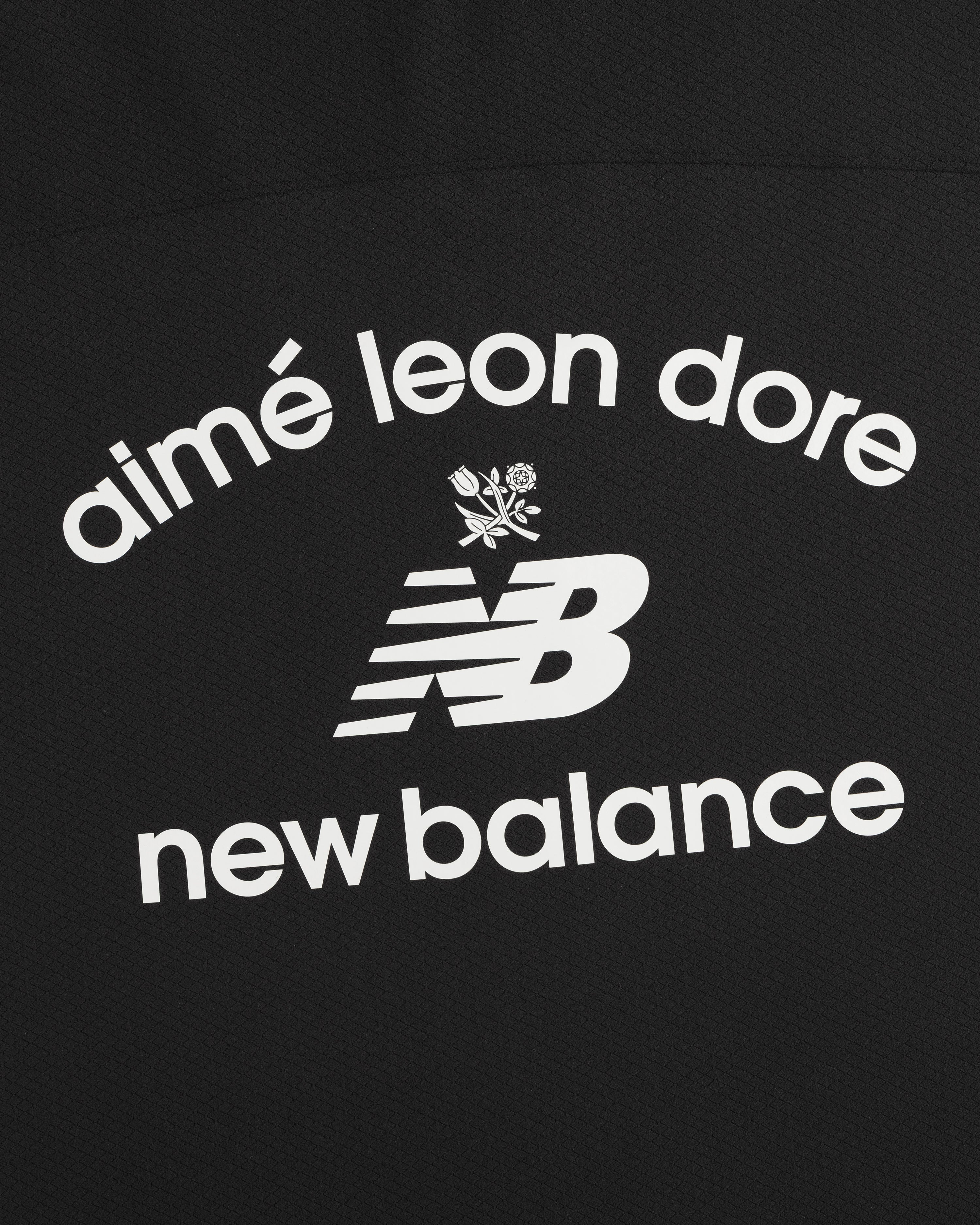 ALD / New Balance Full-Zip Warmup Hoodie: White text and NB logo with floral graphic on black background.